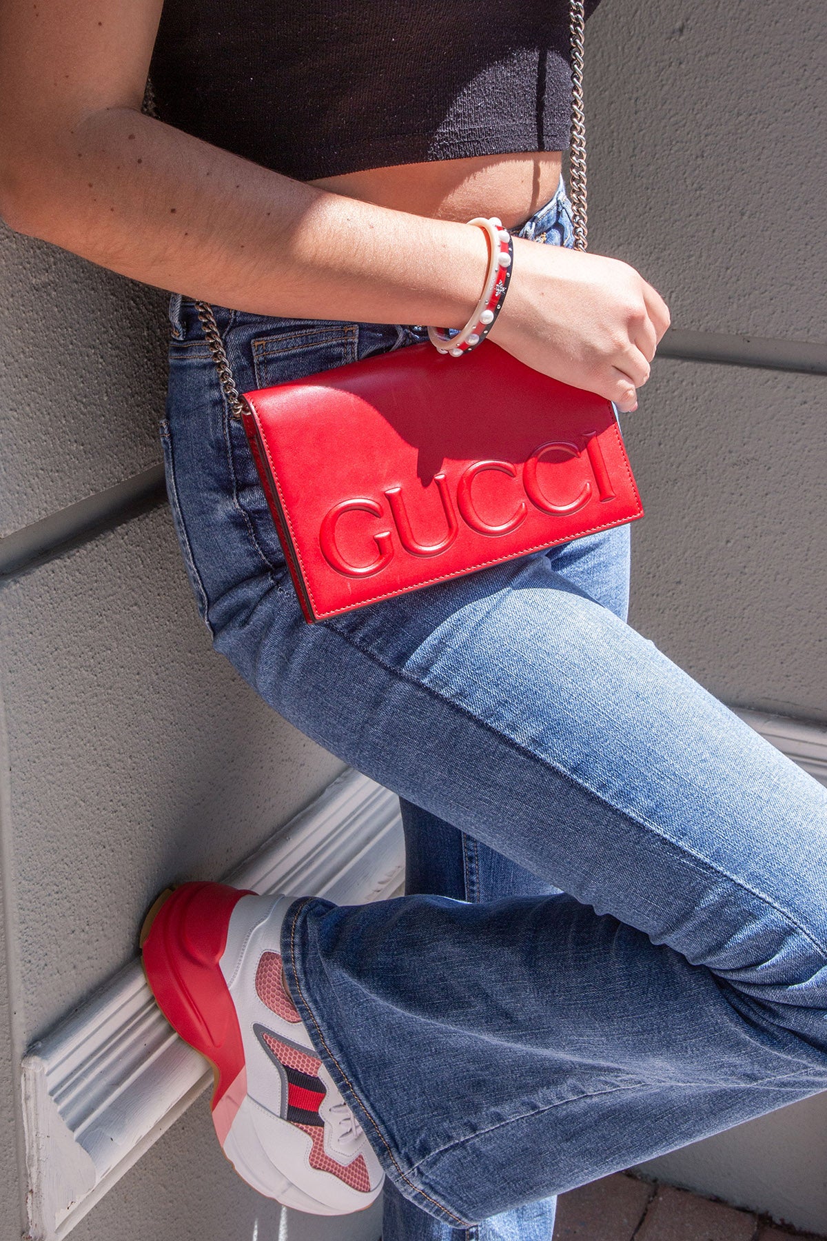 Gucci Logo Embossed Crossbody Bag